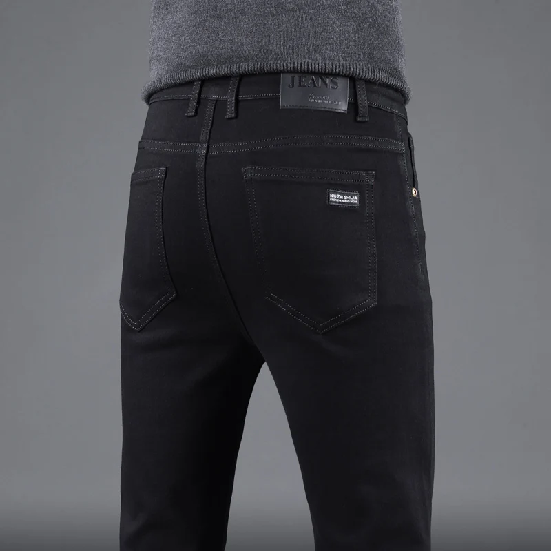 春秋の新メンズピュアブラックスリムジーンズ弾性ストレートパン - Levis Jeans 501 のレビューと価格